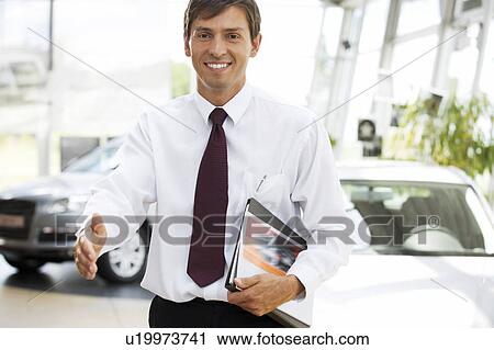 Stock Image - A car salesman. Fotosearch