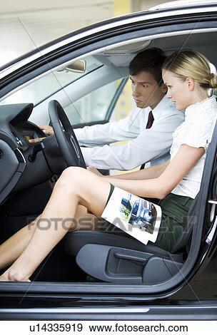 Stock Photo - A salesman talking to a customer. Fotosearch