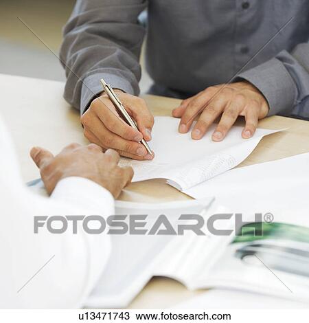 A young man buying a new car View Large Photo Image Stock Image - A young man buying a new car. Fotosearch