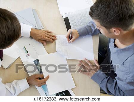 Stock Image - A young man buying a new car. Fotosearch