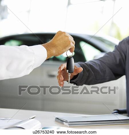 A young man buying a new car View Large Photo Image Stock Image - A young man buying a new car. Fotosearch