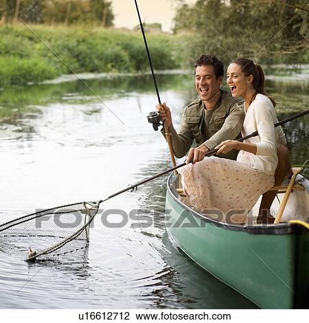 Stock Image - Young couple fishing . Fotosearch