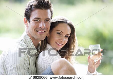 Young couple having a picnic View Large Photo Image Stock Photograph - Young couple having a picnic. Fotosearch