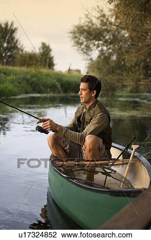 Young man fishing View Large Photo Image Stock Image - Young man fishing. Fotosearch