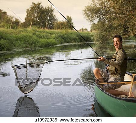 Young man fishing View Large Photo Image Stock Photograph - Young man fishing. Fotosearch
