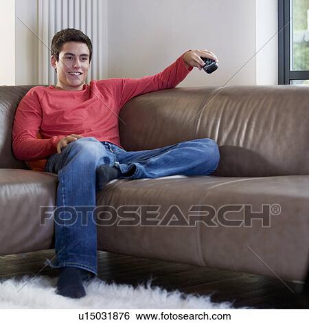 Stock Photograph - A teenage boy watching television. Fotosearch