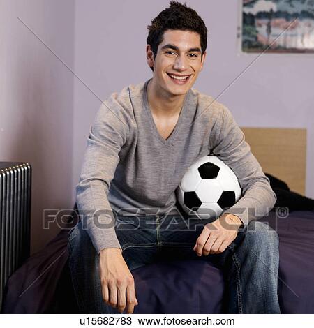 A teenage boy with a football View Large Photo Image Stock Image - A teenage boy with a football. Fotosearch