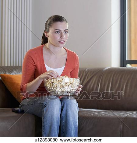A teenage girl watching television View Large Photo Image Stock Image - A teenage girl watching television. Fotosearch