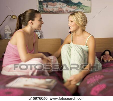 Two teenage girls in a bedroom View Large Photo Image Stock Image - Two teenage girls in a bedroom. Fotosearch