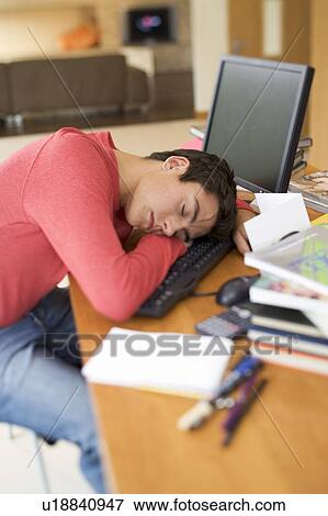 A teenage boy asleep at a computer View Large Photo Image Stock Photo - A teenage boy asleep at a computer. Fotosearch