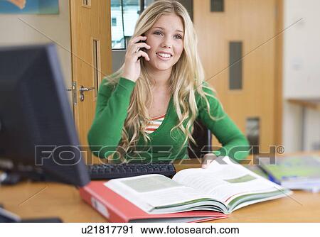 Stock Image - A teenage girl studying. Fotosearch