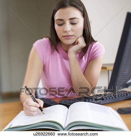 A teenage girl studying View Large Photo Image Stock Image - A teenage girl studying. Fotosearch