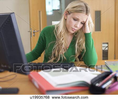 Stock Photo - A teenage girl studying. Fotosearch