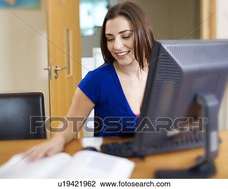 A teenage girl using a computer View Large Photo Image Stock Image - A teenage girl using a computer. Fotosearch