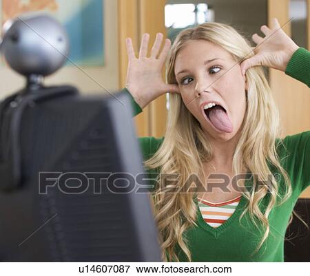 A teenage girl using a computer View Large Photo Image Stock Photo - A teenage girl using a computer. Fotosearch