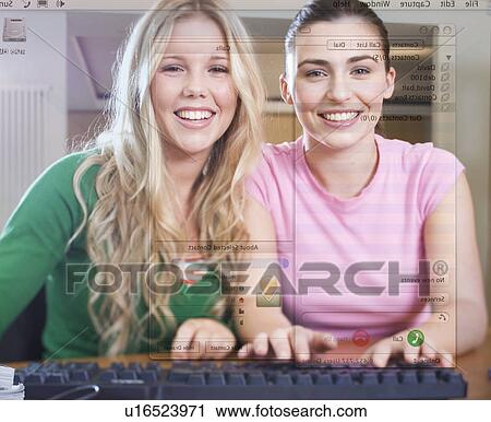 Two teenage girls using a computer View Large Photo Image Stock Image - Two teenage girls using a computer. Fotosearch