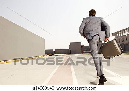 A businessman running View Large Photo Image Stock Image - A businessman running. Fotosearch