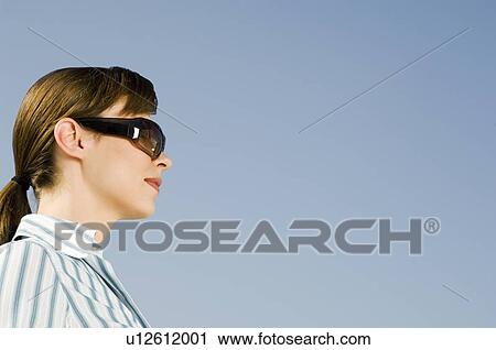 A businesswoman wearing sunglasses View Large Photo Image Stock Image - A businesswoman wearing sunglasses. Fotosearch