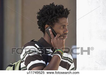 Stock Photography - A student using a mobile phone. Fotosearch