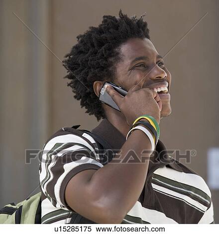 Stock Photography - A student using a mobile phone. Fotosearch