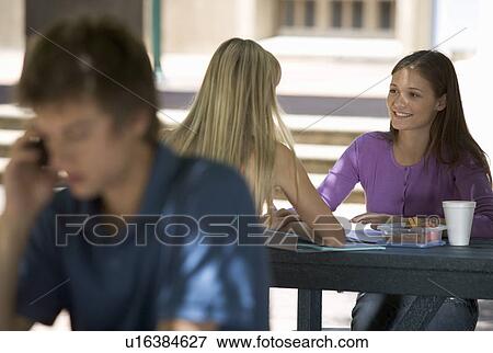 Two university students having a coffee View Large Photo Image Stock Photo - Two university students having a coffee. Fotosearch