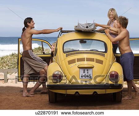 Four friends going surfing View Large Photo Image Stock Image - Four friends going surfing. Fotosearch