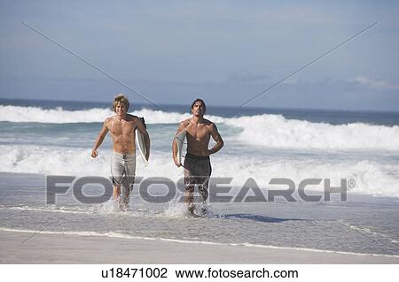 Stock Image - Two surfers. Fotosearch