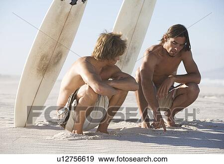 Two surfers View Large Photo Image Stock Photo - Two surfers. Fotosearch