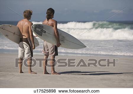 Stock Photo - Two surfers. Fotosearch