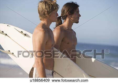 Two surfers View Large Photo Image Stock Photo - Two surfers. Fotosearch