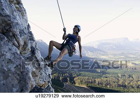 Stock Photo - A climber abseiling. Fotosearch