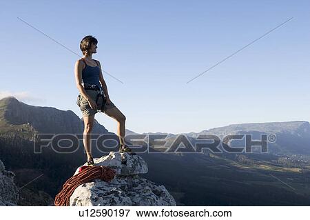 Stock Photo - A climber at the top. Fotosearch