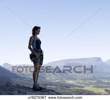 A climber at the top View Large Photo Image Stock Photo - A climber at the top. Fotosearch