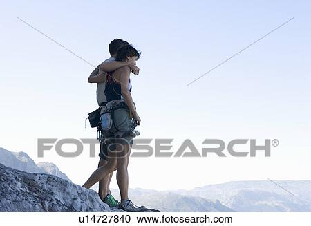 Stock Image - Two climbers at the top. Fotosearch