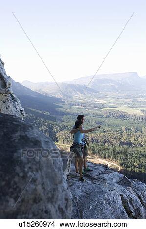 Two climbers looking at the view View Large Photo Image Picture - Two climbers looking at the view. Fotosearch