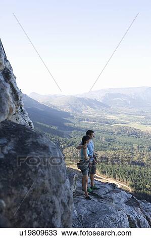Two climbers looking at the view View Large Photo Image Stock Image - Two climbers looking at the view. Fotosearch