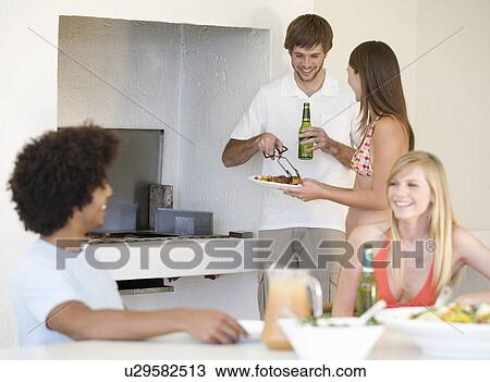 A group of teenage friends at a barbeque View Large Photo Image Stock Image - A group of teenage friends at a barbeque. Fotosearch