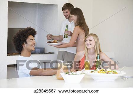 A group of teenage friends at a barbeque View Large Photo Image Stock Photo - A group of teenage friends at a barbeque. Fotosearch