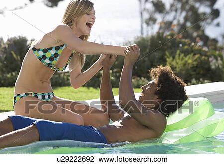 A teenage couple having fun View Large Photo Image Stock Image - A teenage couple having fun. Fotosearch