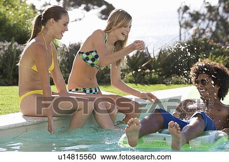 Stock Image - Three teenage friends having fun . Fotosearch