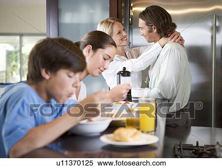A family eating breakfast View Large Photo Image Stock Photography - A family eating breakfast. Fotosearch