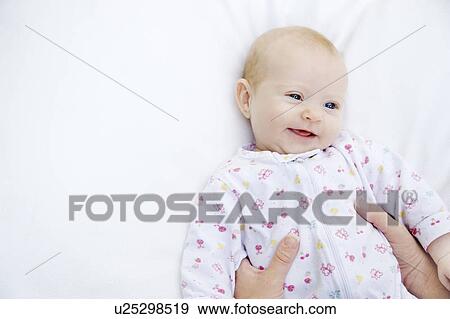 Stock Photo - A baby laughing. Fotosearch