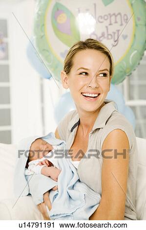 Stock Image - A mother and her new baby. Fotosearch