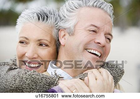Stock Image - A senior couple embracing. Fotosearch