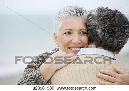 Stock Image - A senior couple embracing. Fotosearch