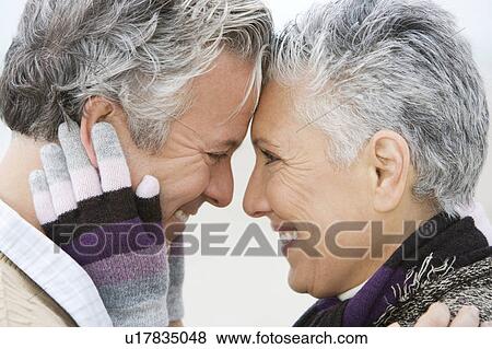 Stock Photo - A senior couple embracing. Fotosearch