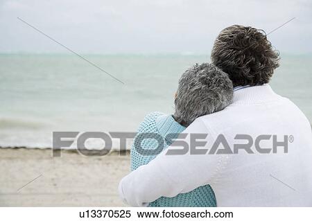 Stock Photography - A senior couple embracing. Fotosearch