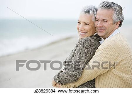 A senior couple on a beach View Large Photo Image Picture - A senior couple on a beach. Fotosearch