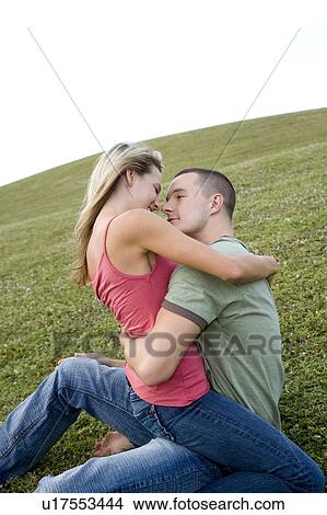 Picture - Two young lovers embracing. Fotosearch