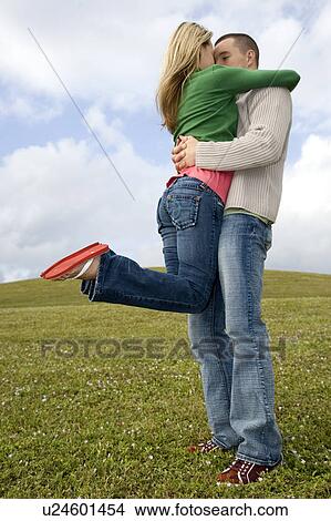 Two young lovers embracing View Large Photo Image Picture - Two young lovers embracing. Fotosearch